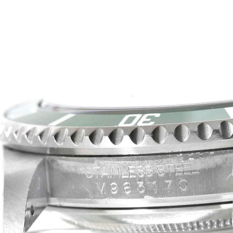 The image shows a close-up side view of the bezel and case, featuring the serial number of a Rolex Submariner 16610LV Men
s Stainless Steel Black Dial 16610LV Men
s Stainless Steel Black Dial watch.