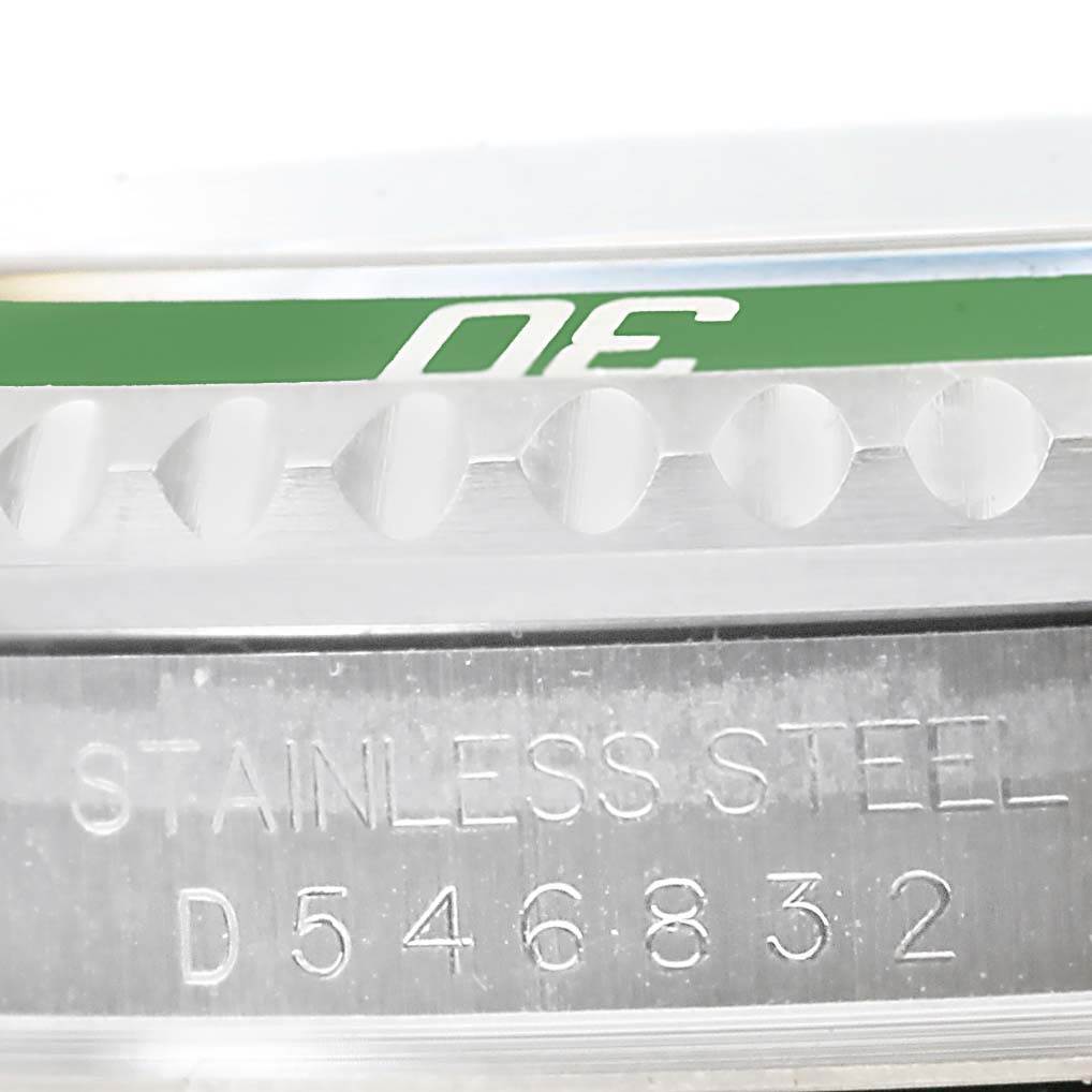 The image shows a close-up of the serial number and bezel edge of a Rolex Submariner 16610LV Men
s Stainless Steel Black Dial 16610LV Men
s Stainless Steel Black Dial watch.