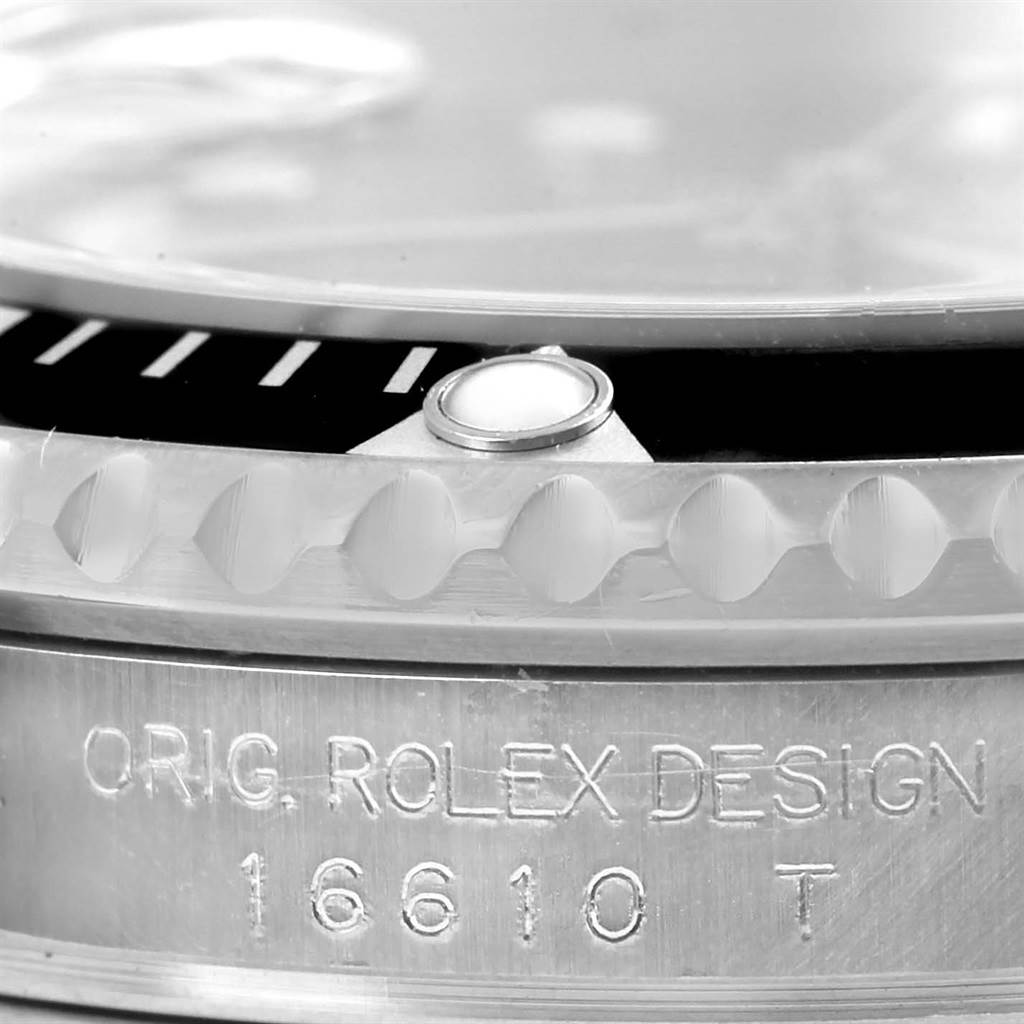 This image shows a close-up of the side of a Rolex Submariner 16610 Men
s Stainless Steel Black Dial 16610 Men
s Stainless Steel Black Dial watch, revealing the bezel, case, and engraved model number (16610).