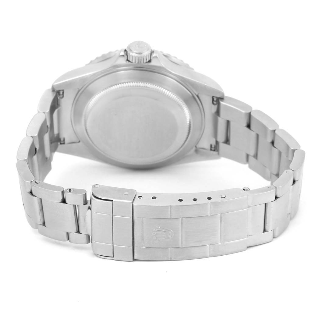 The image shows the back view of a Rolex Submariner 16610LV Men
s Stainless Steel Black Dial 16610LV Men
s Stainless Steel Black Dial watch, highlighting the case back, crown, and bracelet with the clasp.