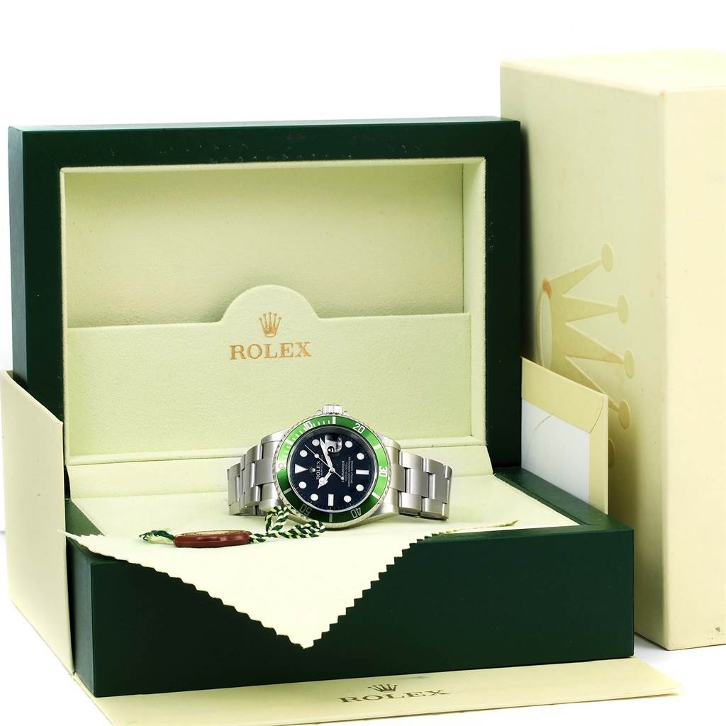 The Rolex Submariner 16610LV Men
s Stainless Steel Black Dial 16610LV Men
s Stainless Steel Black Dial watch is shown in its open box, placed on a cloth, with the bracelet and dial visible.