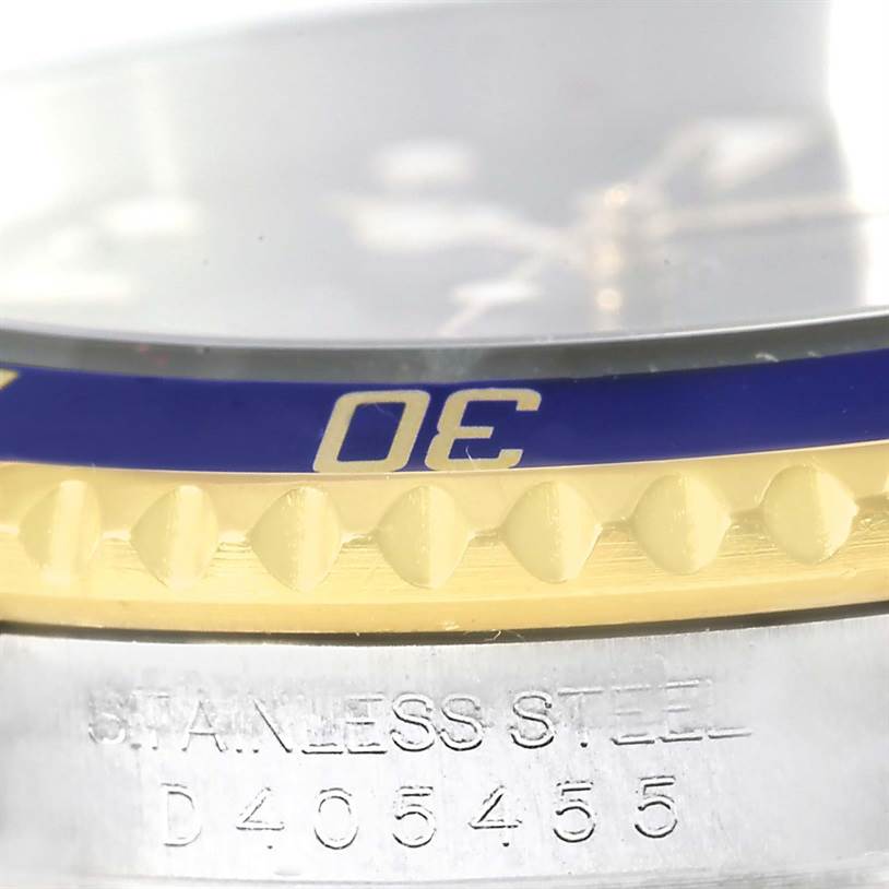 This close-up angle shows the bezel, part of the crystal, and the serial number on a Rolex Submariner 16613 Men
s Steel and Gold (two tone) Blue Dial 16613 Men
s Steel and Gold (two tone) Blue Dial watch.