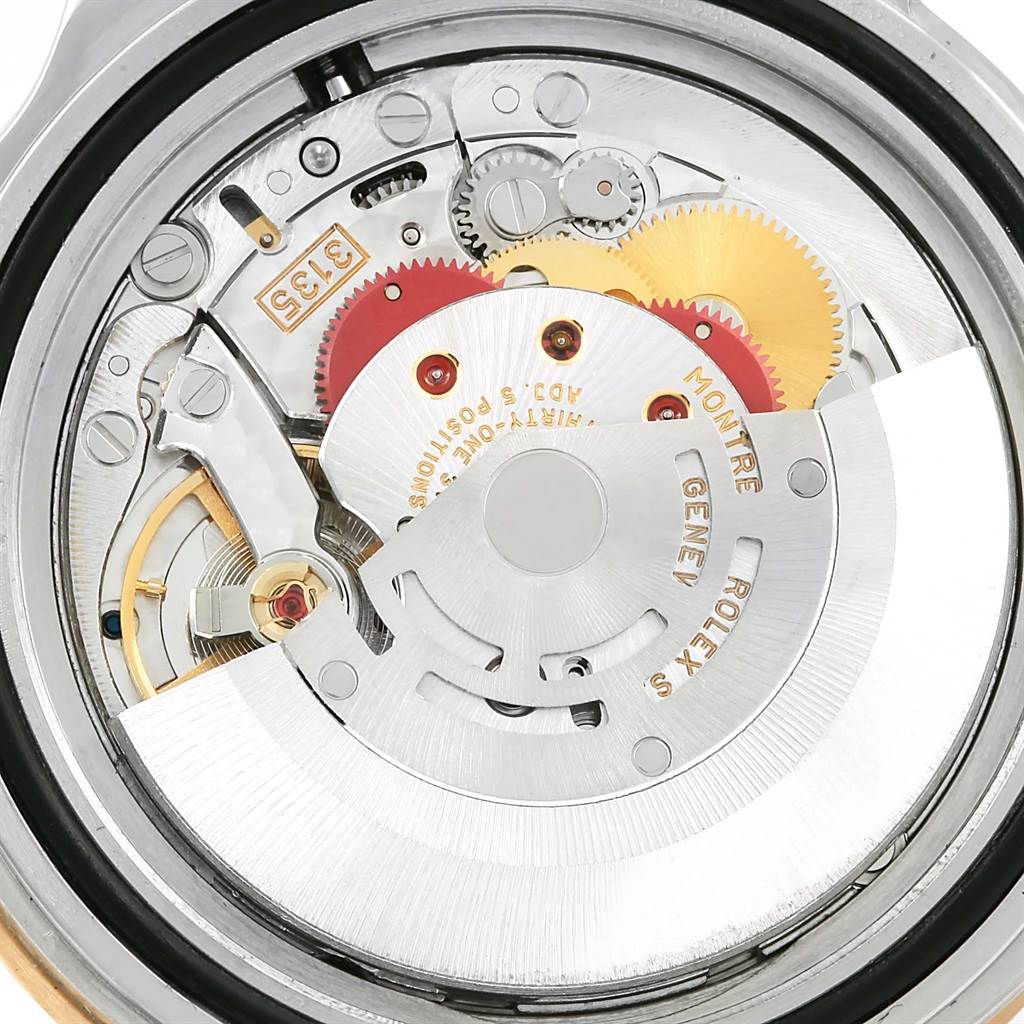 This image shows the intricate internal mechanical movement of the Rolex Submariner 16613 Men
s Steel and Gold (two tone) Grey Dial 16613 Men
s Steel and Gold (two tone) Grey Dial watch.