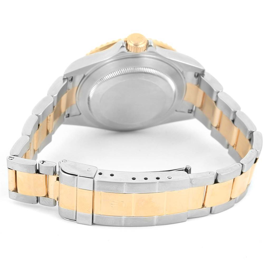 This image displays the case back, crown, and bracelet of the Rolex Submariner 16613 Men
s Steel and Gold (two tone) Black Dial 16613 Men
s Steel and Gold (two tone) Black Dial watch from a rear angle.