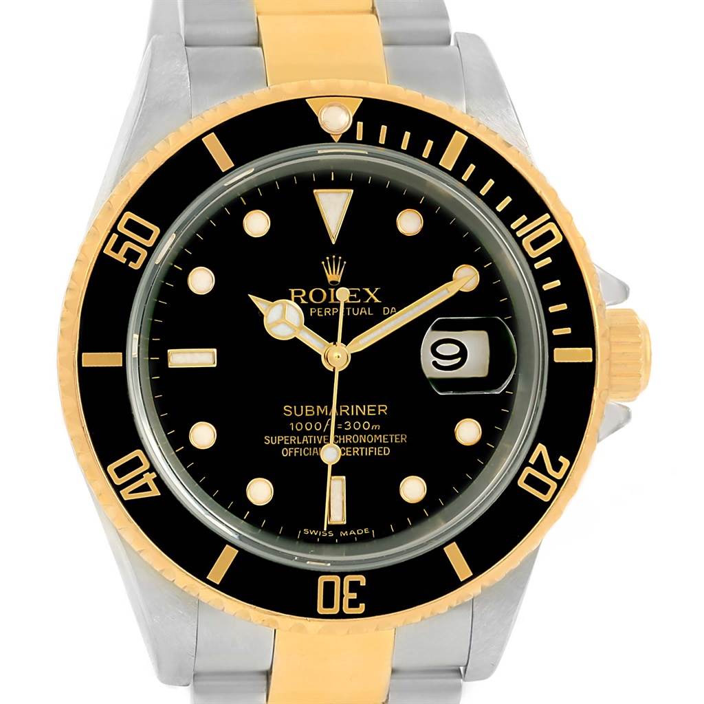 The Rolex Submariner 16613 Men
s Steel and Gold (two tone) Black Dial 16613 Men
s Steel and Gold (two tone) Black Dial watch is shown from a top-down angle, highlighting the dial, bezel, and part of the bracelet.