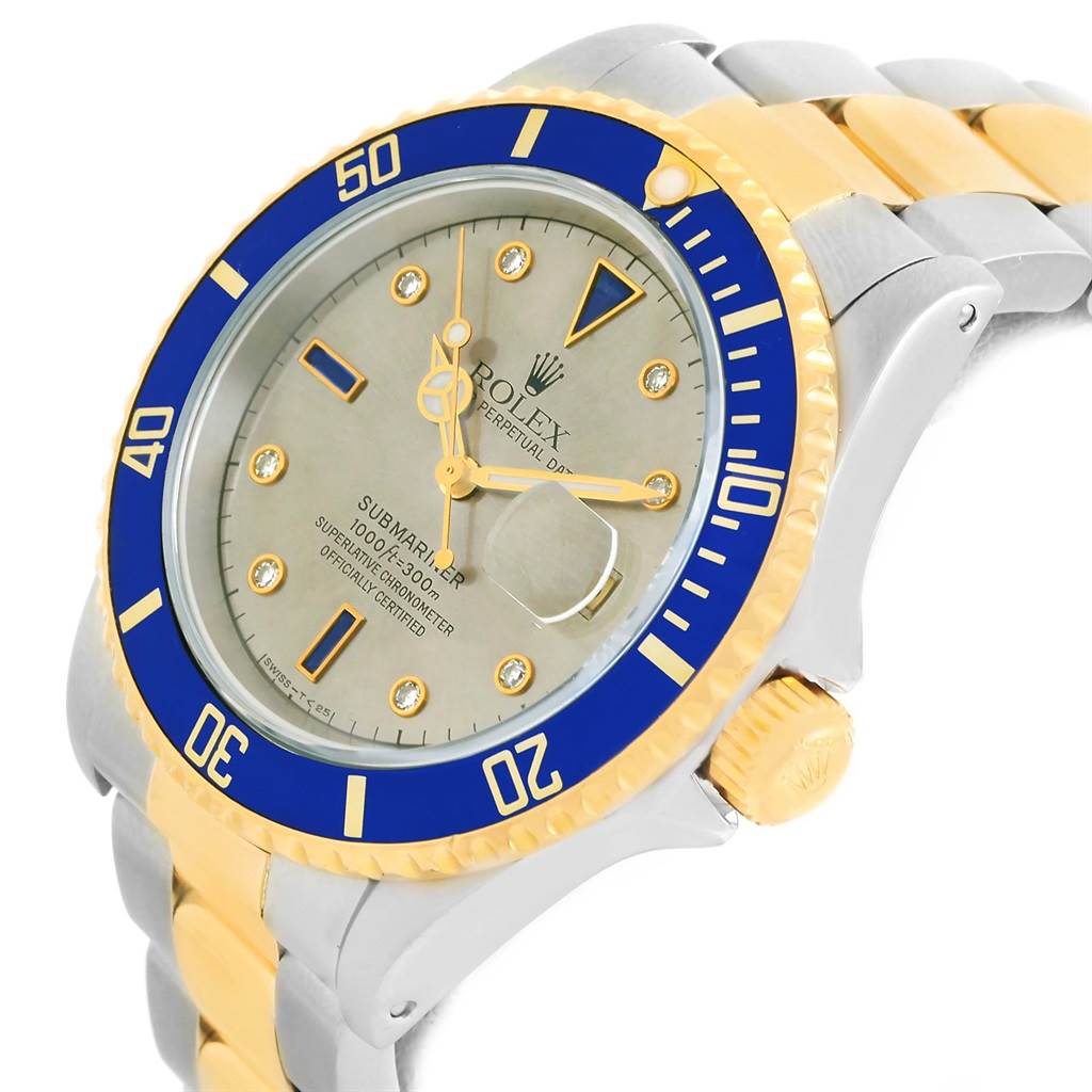 The image shows the face and bezel of a Rolex Submariner 16613 Men
s Steel and Gold (two tone) Grey Dial 16613 Men
s Steel and Gold (two tone) Grey Dial watch at an angled view, highlighting the crown and bracelet.