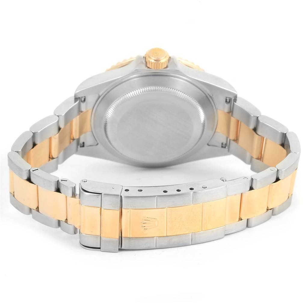 The image shows the back case and metal strap of a Rolex Submariner 16613 Men
s Steel and Gold (two tone) Blue Dial 16613 Men
s Steel and Gold (two tone) Blue Dial watch from a rear angle.