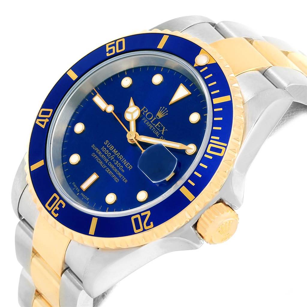 This image shows a Rolex Submariner 16613 Men
s Steel and Gold (two tone) Blue Dial 16613 Men
s Steel and Gold (two tone) Blue Dial watch at an angle, highlighting the blue and gold bezel, dial, and part of the metal strap.