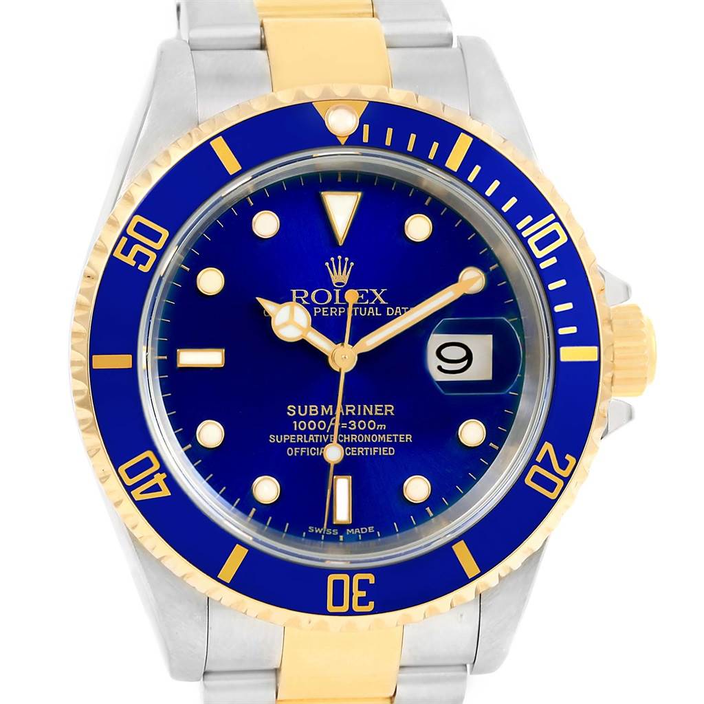 The image shows a front view of a Rolex Submariner 16613 Men
s Steel and Gold (two tone) Blue Dial 16613 Men
s Steel and Gold (two tone) Blue Dial watch, highlighting its blue dial, gold and silver bracelet, and date display.