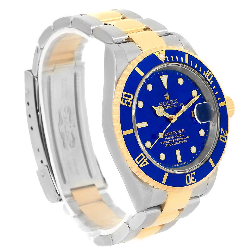 The image shows a Rolex Submariner 16613 Men
s Steel and Gold (two tone) Blue Dial 16613 Men
s Steel and Gold (two tone) Blue Dial watch from a slight side angle, displaying the face, bezel, and part of the bracelet.