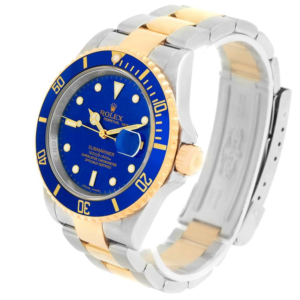 This image shows a Rolex Submariner 16613 Men
s Steel and Gold (two tone) Blue Dial 16613 Men
s Steel and Gold (two tone) Blue Dial watch at an angle highlighting the blue dial, gold and silver bracelet, and bezel.