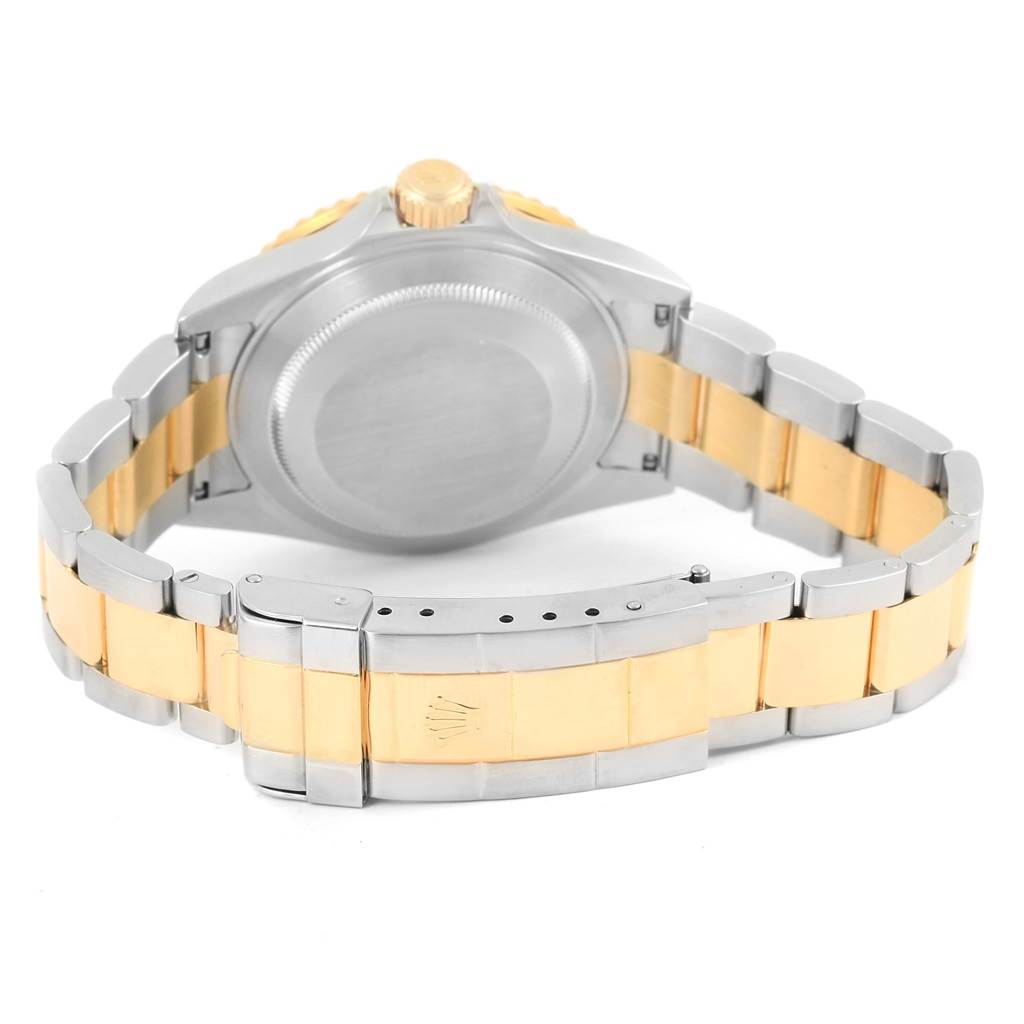 The image shows the back and bracelet of a Rolex Submariner 16613 Men
s Steel and Gold (two tone) Blue Dial 16613 Men
s Steel and Gold (two tone) Blue Dial watch, focusing on the clasp and case back.