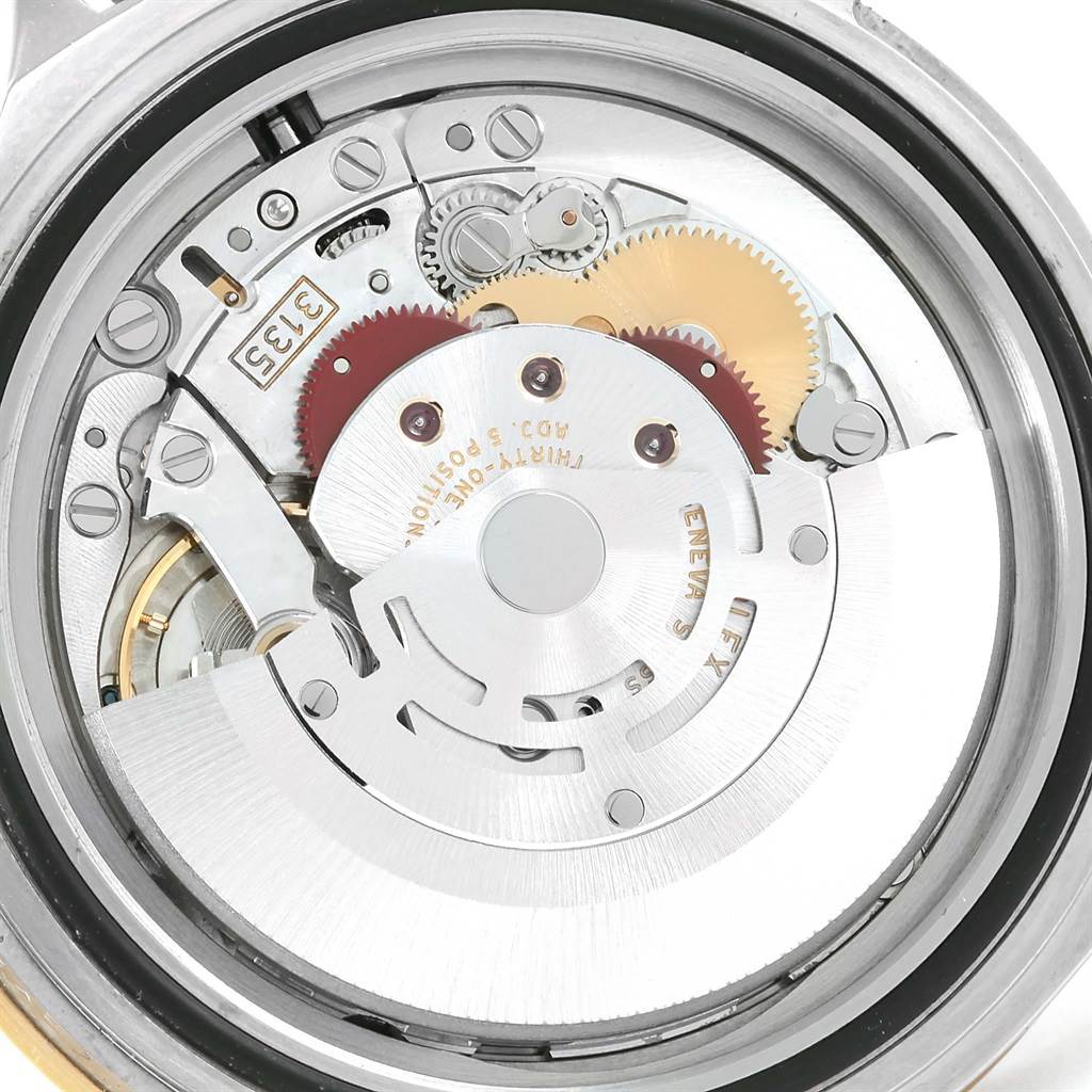 This image shows the internal mechanism of a Rolex Submariner 16613 Men
s Steel and Gold (two tone) Blue Dial 16613 Men
s Steel and Gold (two tone) Blue Dial watch, highlighting gears and the rotor.