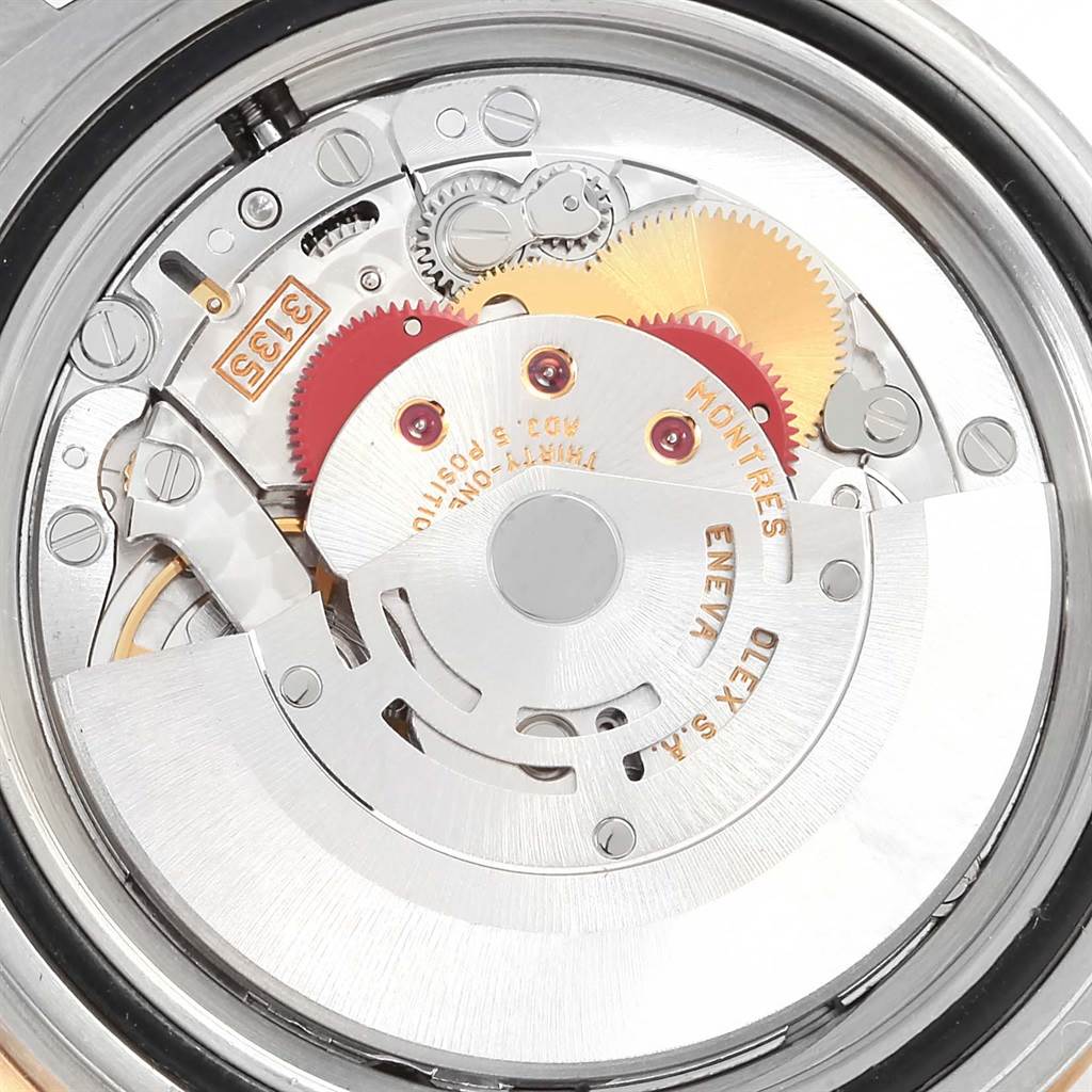 This image shows the intricate internal movement mechanism of a Rolex Submariner 16613 Men
s Steel and Gold (two tone) Black Dial 16613 Men
s Steel and Gold (two tone) Black Dial watch up close.