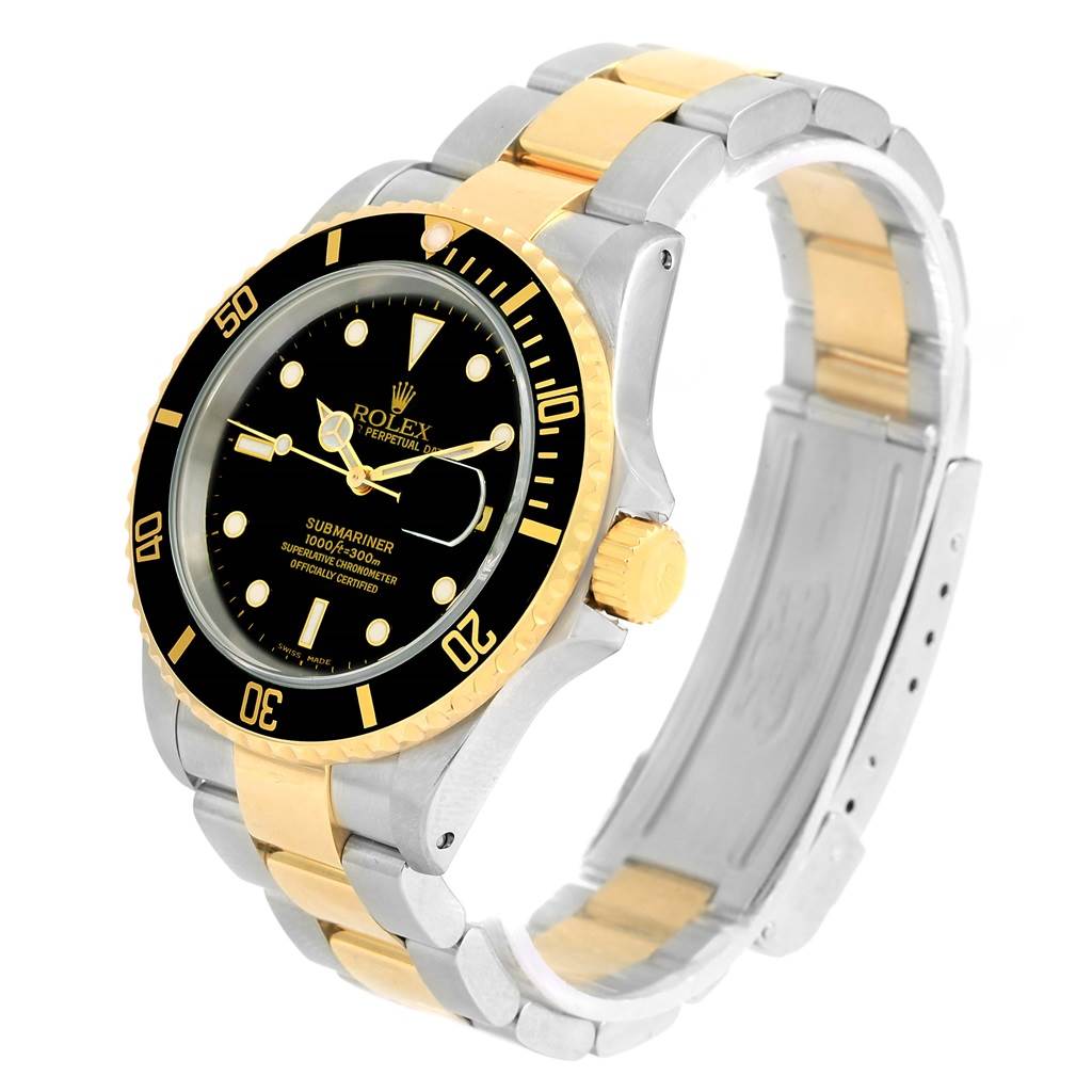 The image shows a Rolex Submariner 16613 Men
s Steel and Gold (two tone) Black Dial 16613 Men
s Steel and Gold (two tone) Black Dial watch at a three-quarter angle, highlighting the dial, bezel, crown, and two-tone bracelet.