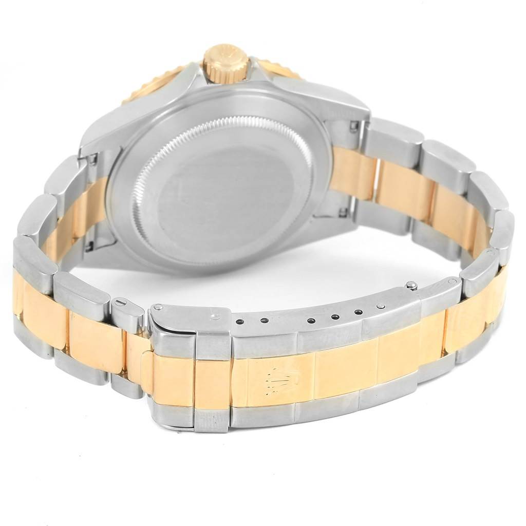 This image shows the back of a Rolex Submariner 16613 Men
s Steel and Gold (two tone) Blue Dial 16613 Men
s Steel and Gold (two tone) Blue Dial watch, highlighting the case, crown, and two-tone metal bracelet.