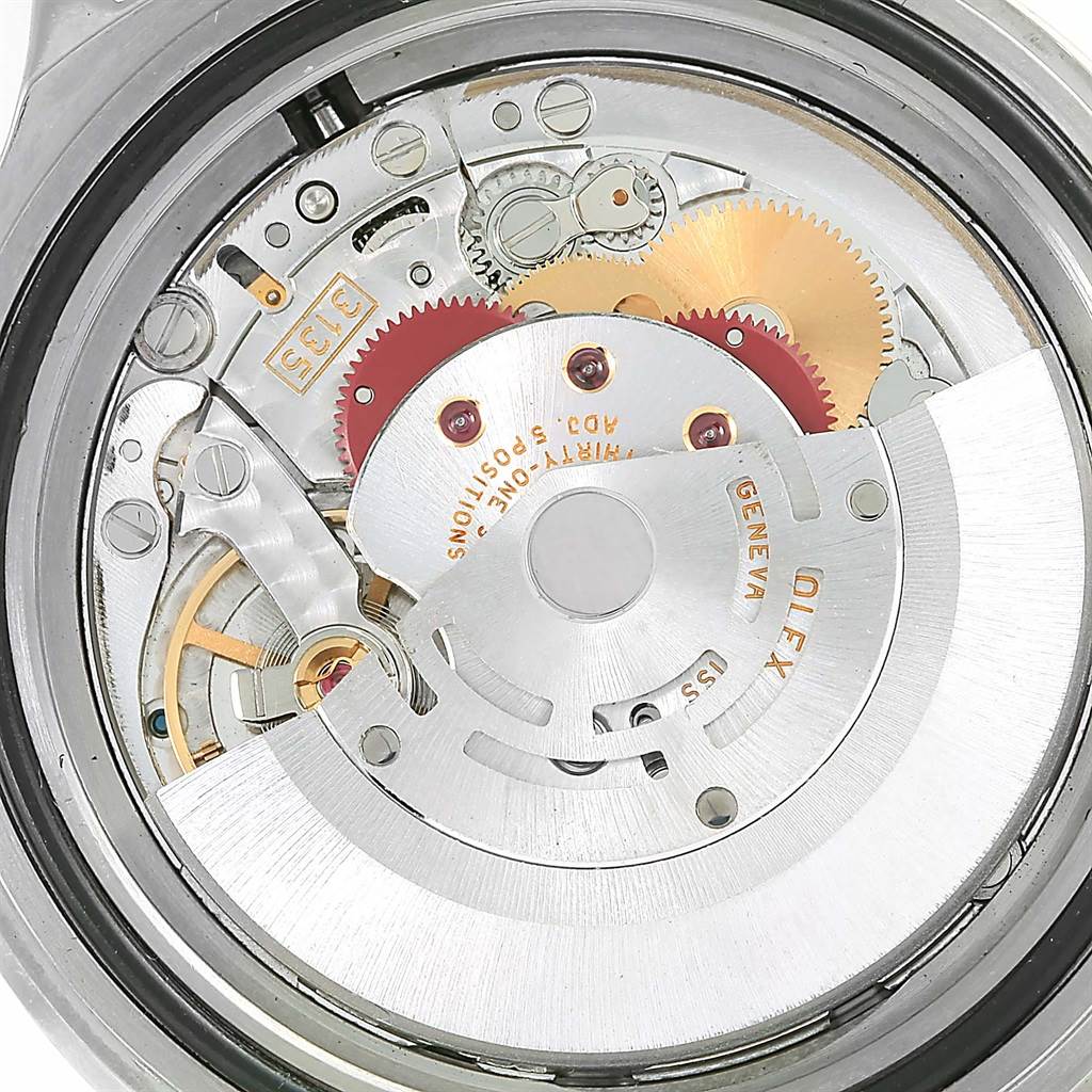 The image shows an internal view of the Rolex Submariner 16610 Men
s Stainless Steel Black Dial 16610 Men
s Stainless Steel Black Dial
s movement from a top-down angle, highlighting its intricate mechanical components.