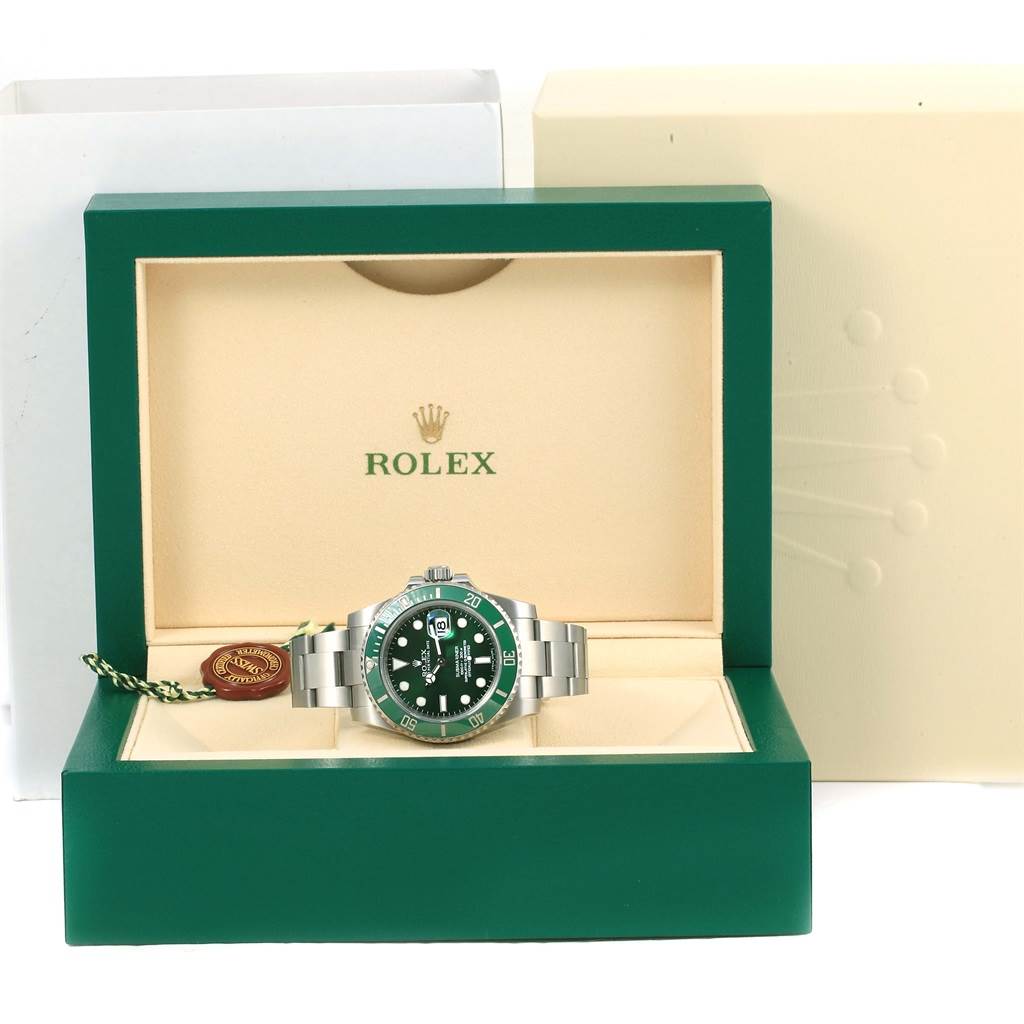 The Rolex Submariner 116610LV Men
s Stainless Steel Green Dial 116610LV Men
s Stainless Steel Green Dial watch is displayed in its green and cream box, showing the front of the watch and part of the bracelet.