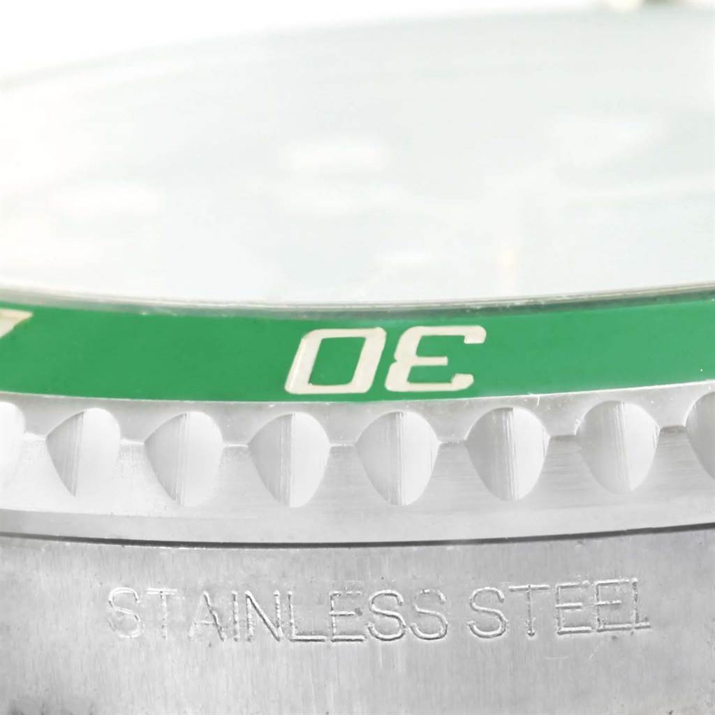 This close-up image shows the stainless steel bezel and part of the green diving bezel of the Rolex Submariner 116610LV Men
s Stainless Steel Green Dial 116610LV Men
s Stainless Steel Green Dial.