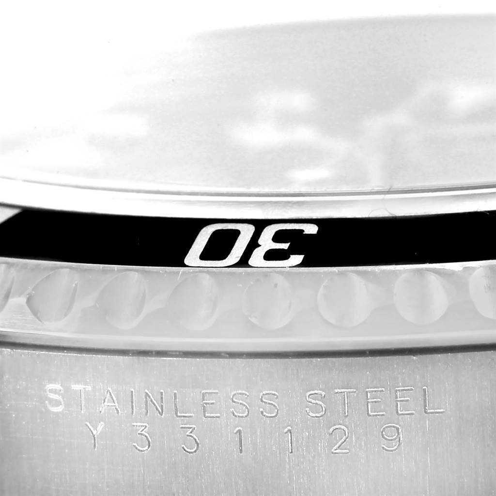 The image shows a close-up of the bezel and case back of a Rolex Submariner 14060 Men
s Stainless Steel Black Dial 14060 Men
s Stainless Steel Black Dial watch.