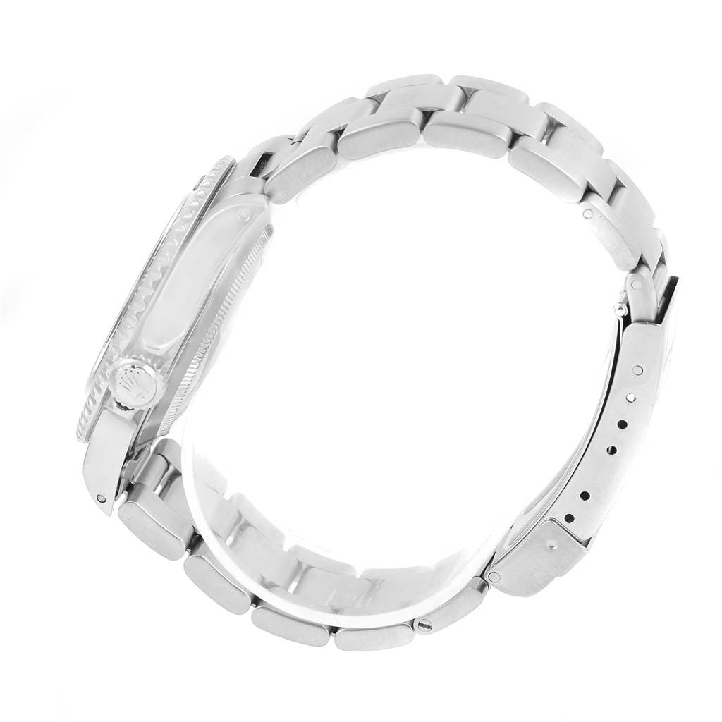 The image shows a side view of a Rolex Submariner 14060 Men
s Stainless Steel Black Dial 14060 Men
s Stainless Steel Black Dial model, highlighting its bracelet, clasp, and crown.