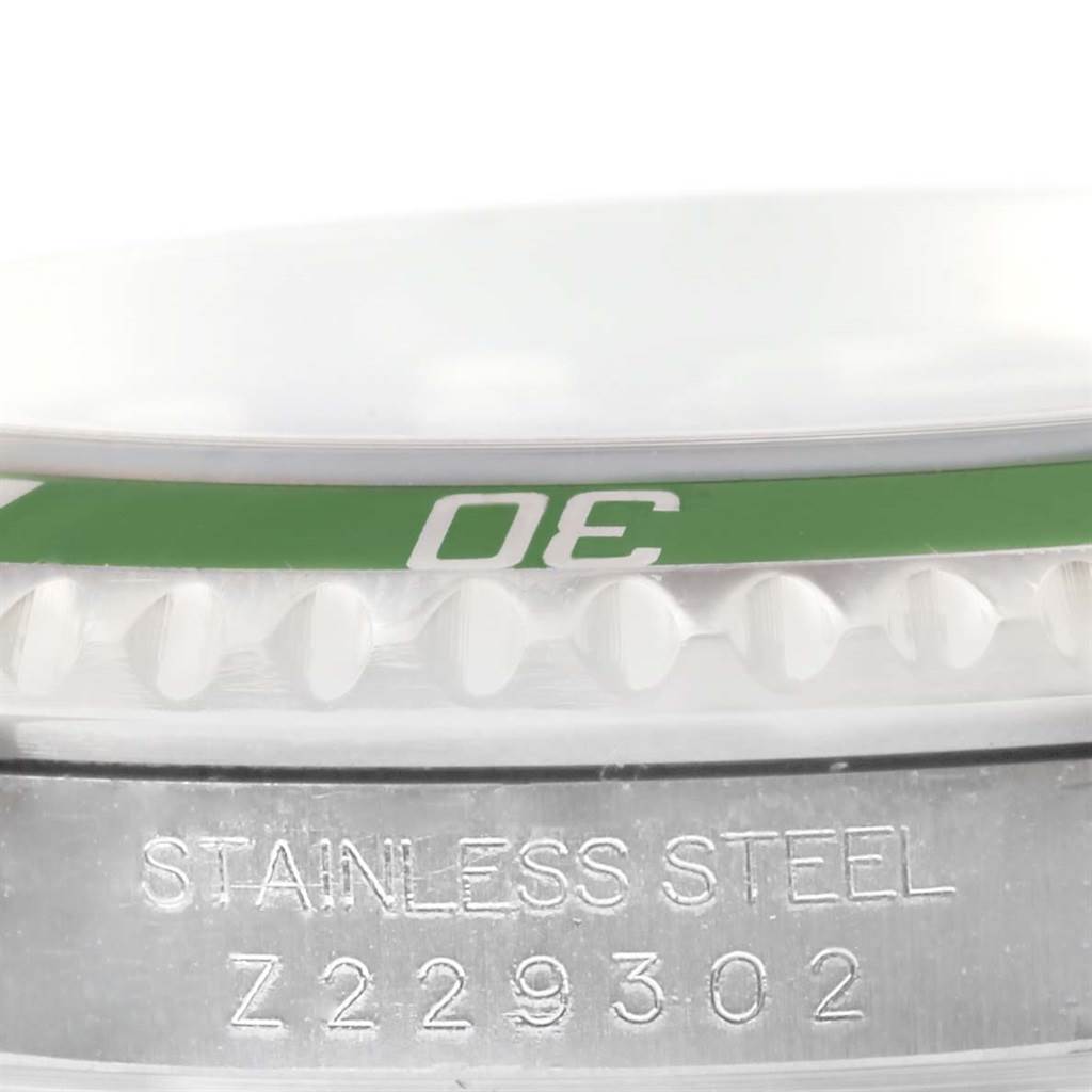 A close-up side view of the Rolex Submariner 16610LV Men
s Stainless Steel Black Dial 16610LV Men
s Stainless Steel Black Dial showing the bezel with "30" marking and engraved serial number on the stainless steel case.