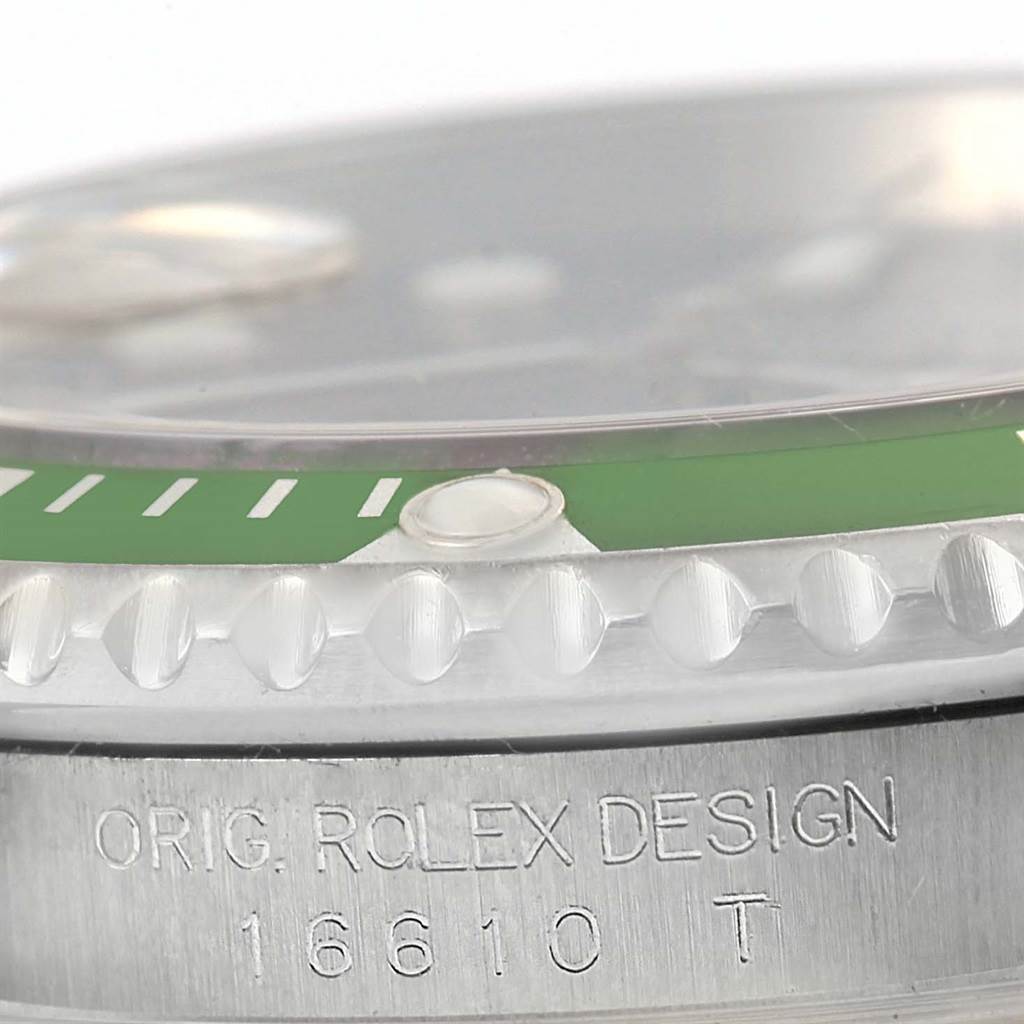 This close-up angle of the Rolex Submariner 16610LV Men
s Stainless Steel Black Dial 16610LV Men
s Stainless Steel Black Dial watch shows part of the bezel and the engraved model number 16610 on the case.