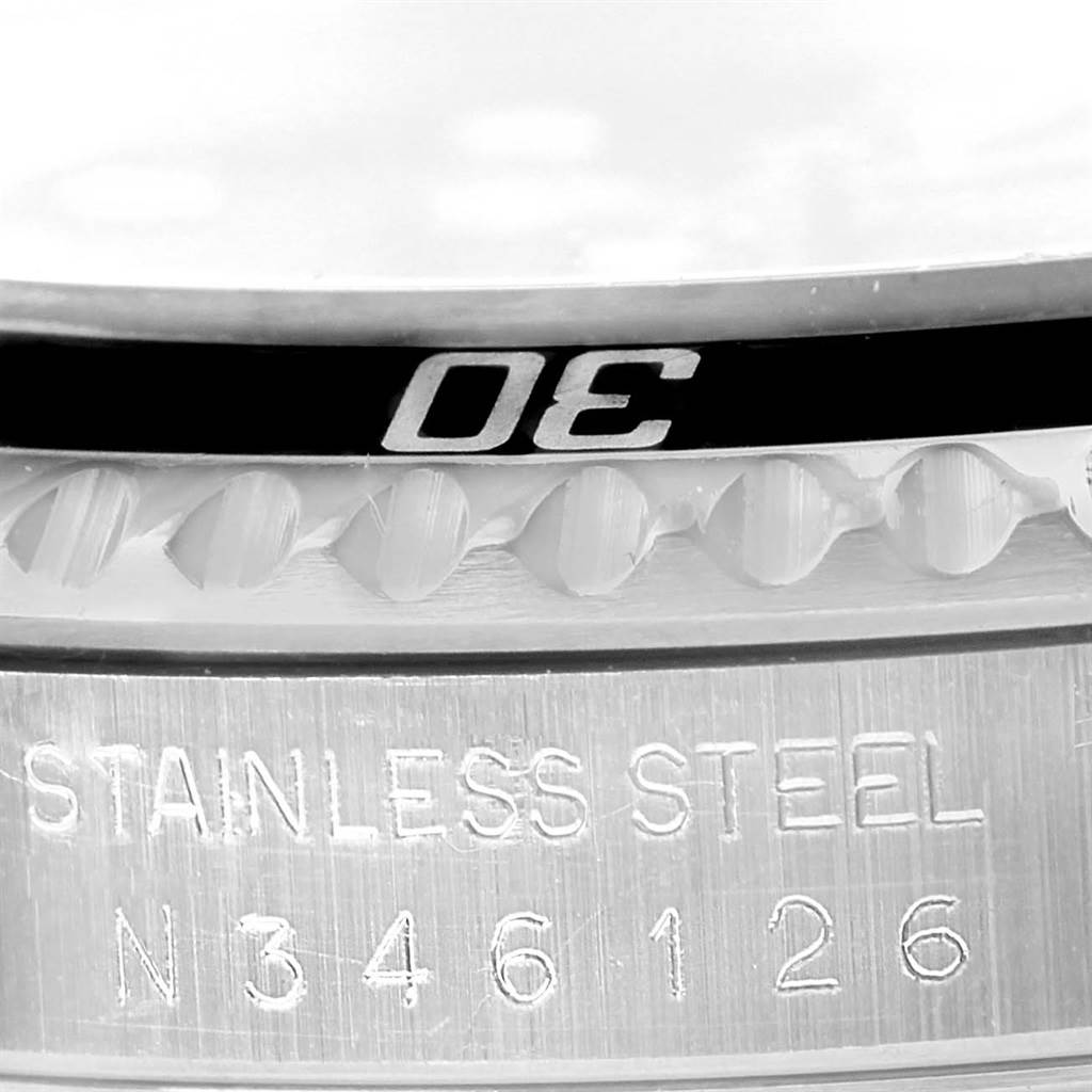 The close-up image shows the bezel and part of the stainless steel casing of a Rolex Submariner 14060 Men
s Stainless Steel Black Dial 14060 Men
s Stainless Steel Black Dial watch.