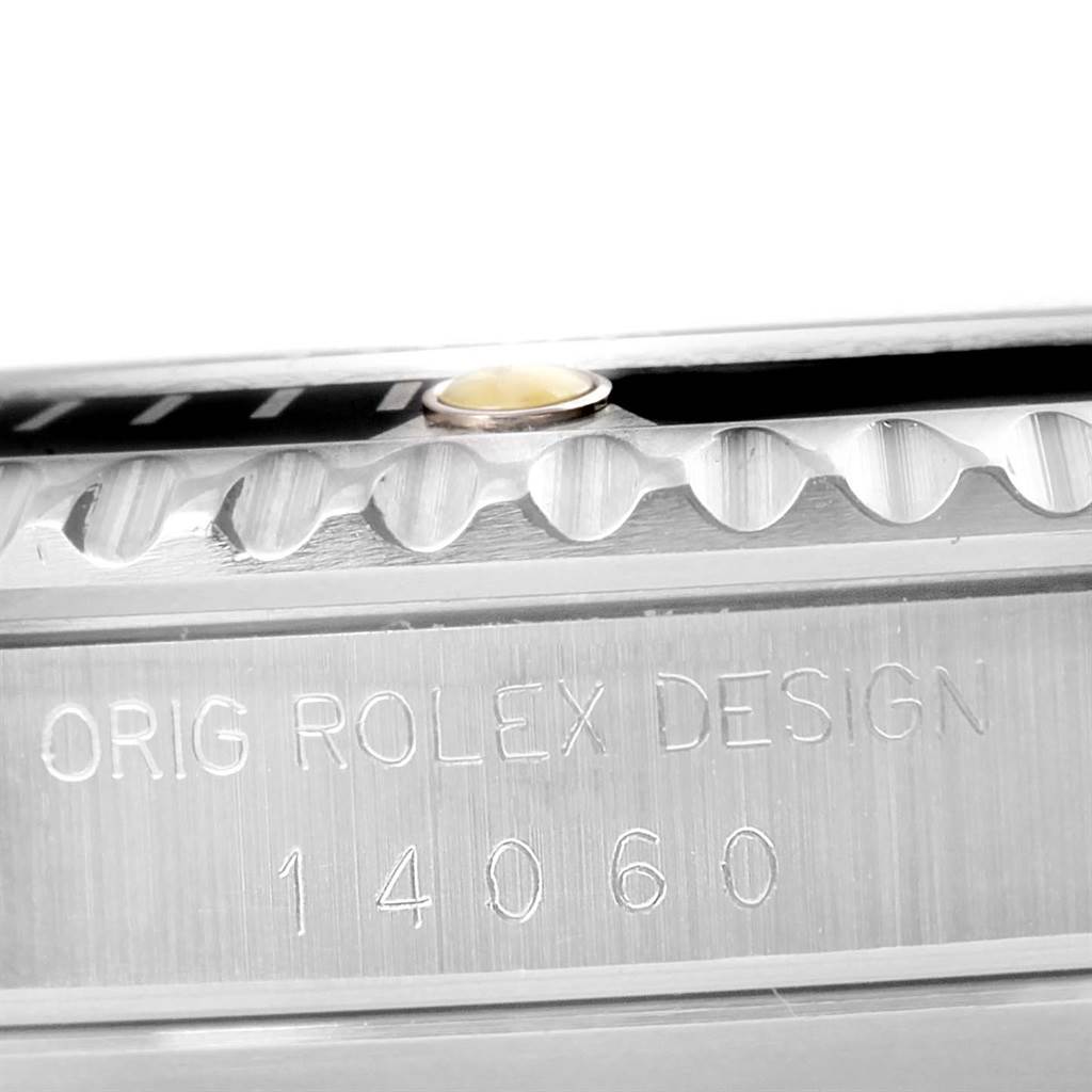 This image shows a close-up angle of the Rolex Submariner 14060 Men
s Stainless Steel Black Dial 14060 Men
s Stainless Steel Black Dial
s case edge with the model number "14060" engraved.