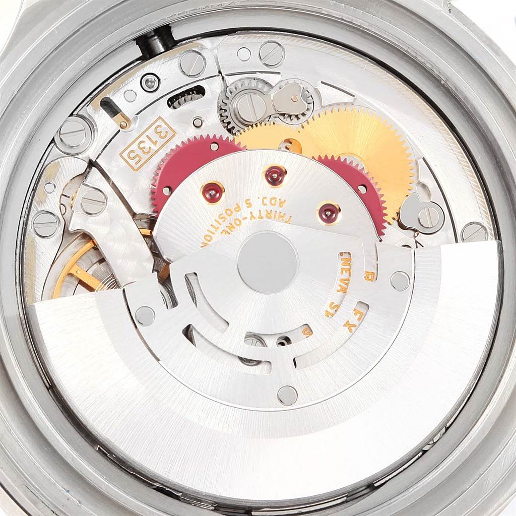 This image shows the internal mechanism of a Rolex Submariner 16610 Men
s Stainless Steel Black Dial 16610 Men
s Stainless Steel Black Dial, highlighting its gears and movement components.