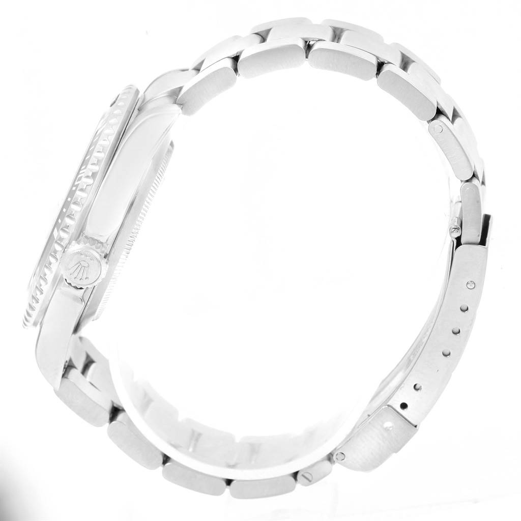 The image shows a side profile of the Rolex Submariner 16610 Men
s Stainless Steel Black Dial 16610 Men
s Stainless Steel Black Dial watch, highlighting the bracelet and crown.