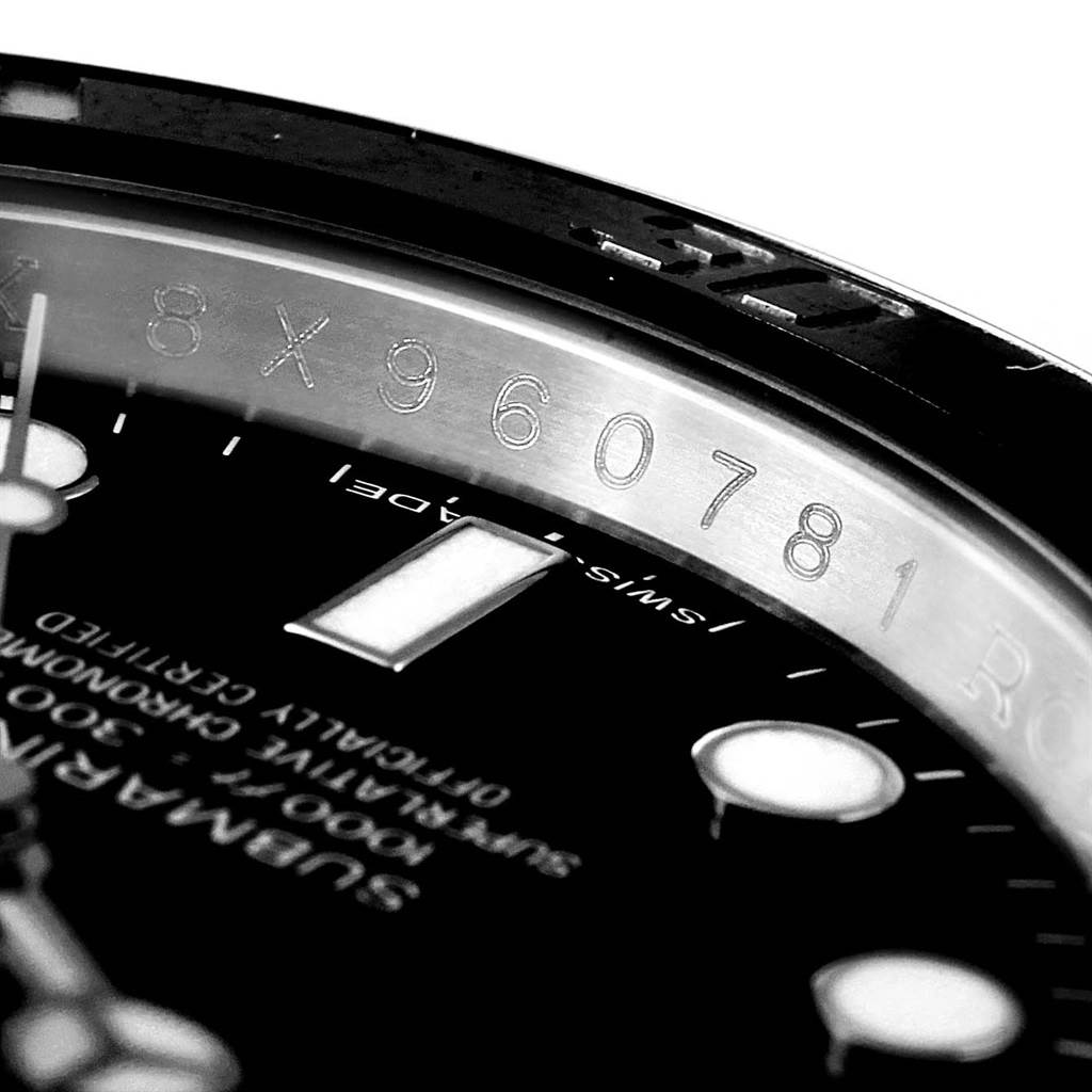 This image shows a close-up of the dial, bezel, and rehaut with serial number of the Rolex Submariner 114060 Men
s Stainless Steel Black Dial 114060 Men
s Stainless Steel Black Dial watch.