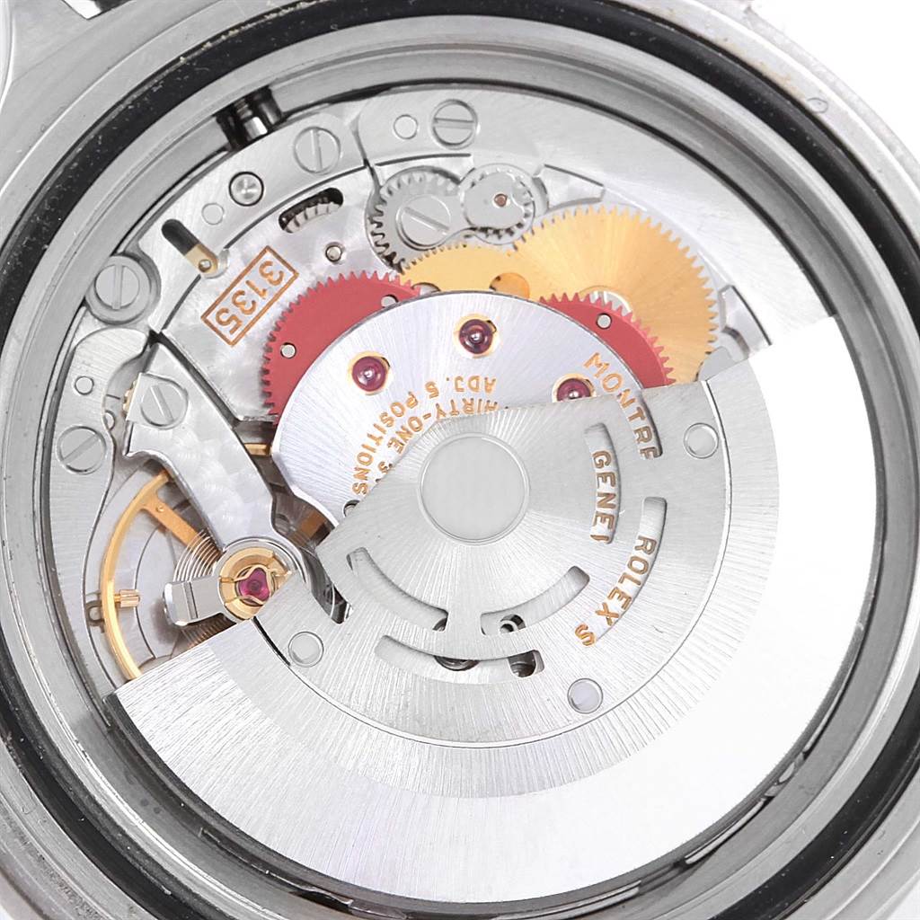 This image shows the inner mechanical movement of a Rolex Submariner 16610 Men
s Stainless Steel Black Dial 16610 Men
s Stainless Steel Black Dial watch from a rear angle.