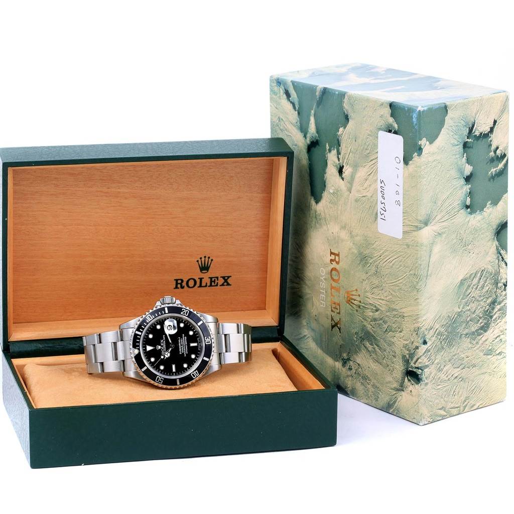The image shows a Rolex Submariner 16610 Men
s Stainless Steel Black Dial 16610 Men
s Stainless Steel Black Dial watch in its branded box, viewed from the front angle.