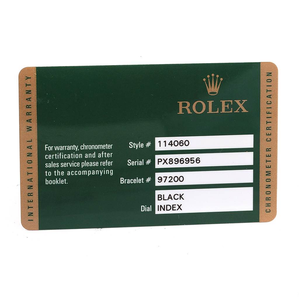 The image shows a green warranty card for a Rolex Submariner 114060 Men
s Stainless Steel Black Dial 114060 Men
s Stainless Steel Black Dial, including style, serial, bracelet numbers, and dial information.