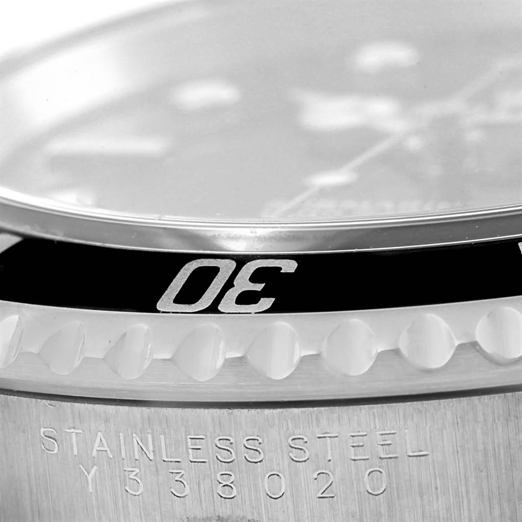 The image shows a close-up of the bezel and serial number area of a Rolex Submariner 14060 Men
s Stainless Steel Black Dial 14060 Men
s Stainless Steel Black Dial watch.