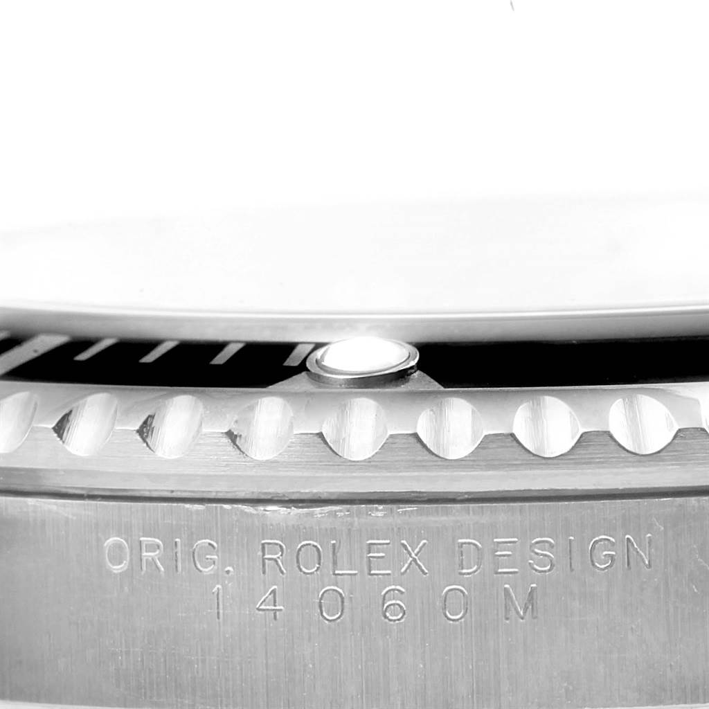 This image shows a close-up of the bezel and case side of the Rolex Submariner 14060 Men
s Stainless Steel Black Dial 14060 Men
s Stainless Steel Black Dial watch, model 14060M.