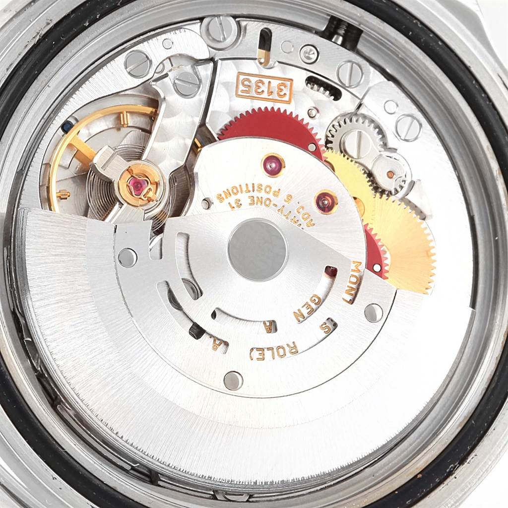 The image shows the intricate internal mechanism of a Rolex Submariner 16610 Men
s Stainless Steel Black Dial 16610 Men
s Stainless Steel Black Dial watch, viewed from the back.