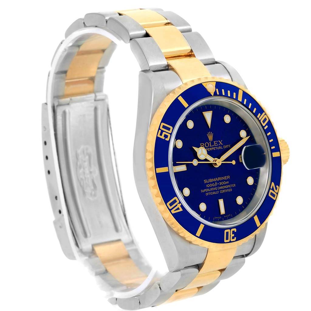 The image shows a Rolex Submariner 16613 Men's Steel and Gold (two tone) Blue Dial 16613 Men's Steel and Gold (two tone) Blue Dial watch from an angled side view, displaying its blue dial, bezel, and two-tone metal bracelet.