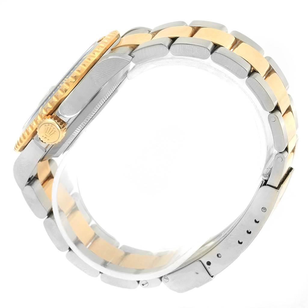 This image shows a side view of the Rolex Submariner 16613 Men's Steel and Gold (two tone) Blue Dial 16613 Men's Steel and Gold (two tone) Blue Dial, highlighting its two-tone bracelet, crown, and part of the bezel.