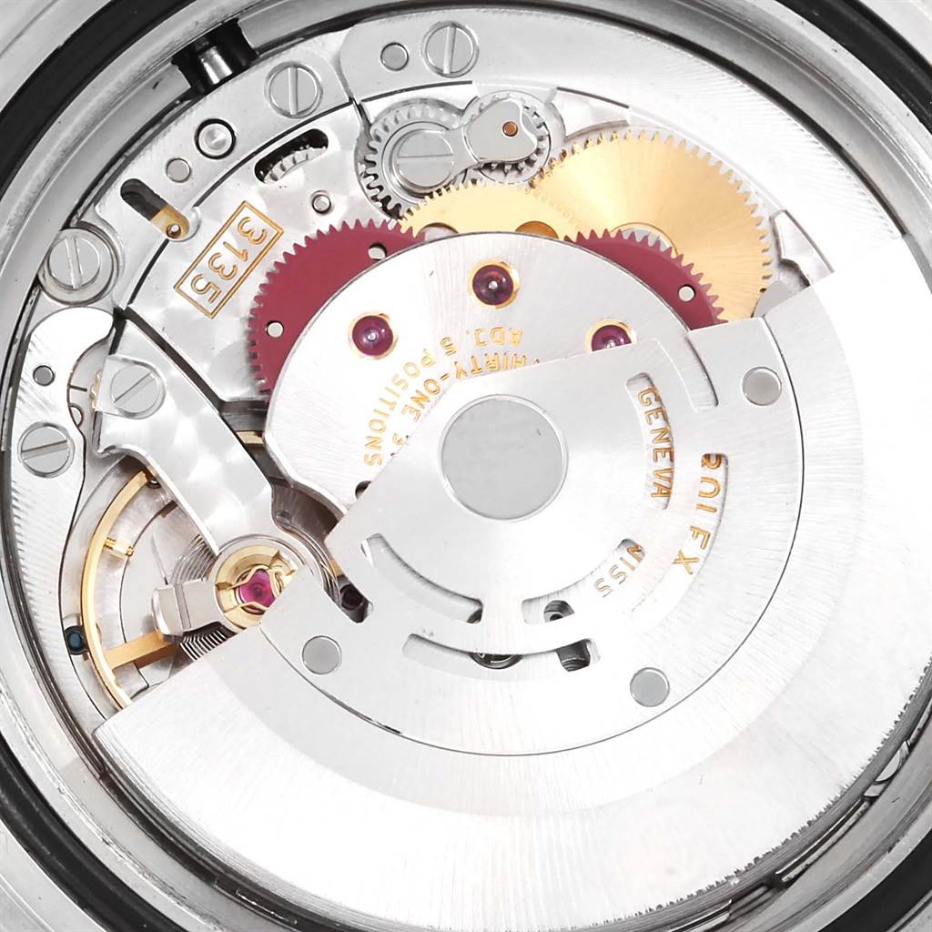 The image shows a close-up view of the movement components of a Rolex Submariner 16610LV Men
s Stainless Steel Black Dial 16610LV Men
s Stainless Steel Black Dial watch.