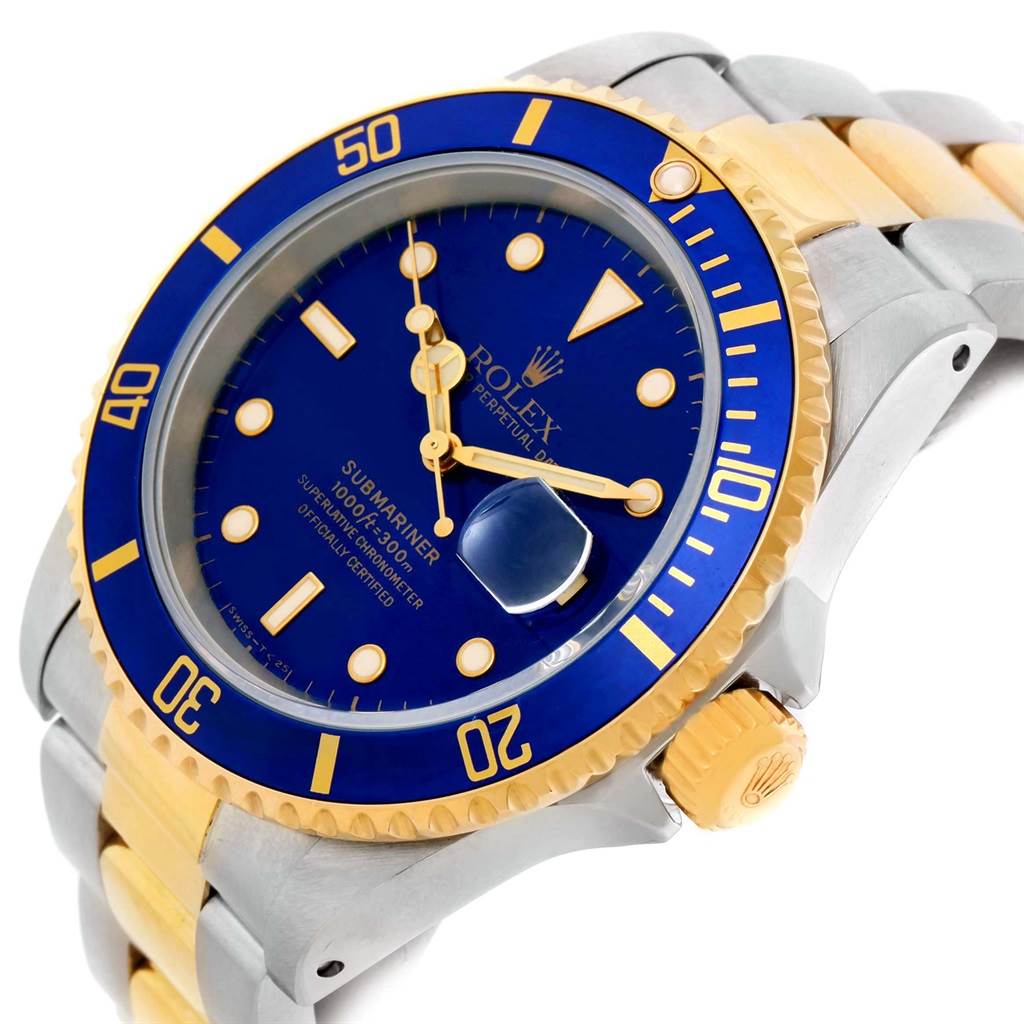 The image shows a Rolex Submariner 16613 Men's Steel and Gold (two tone) Blue Dial 16613 Men's Steel and Gold (two tone) Blue Dial watch from an angle highlighting the face, crown, and part of the strap.