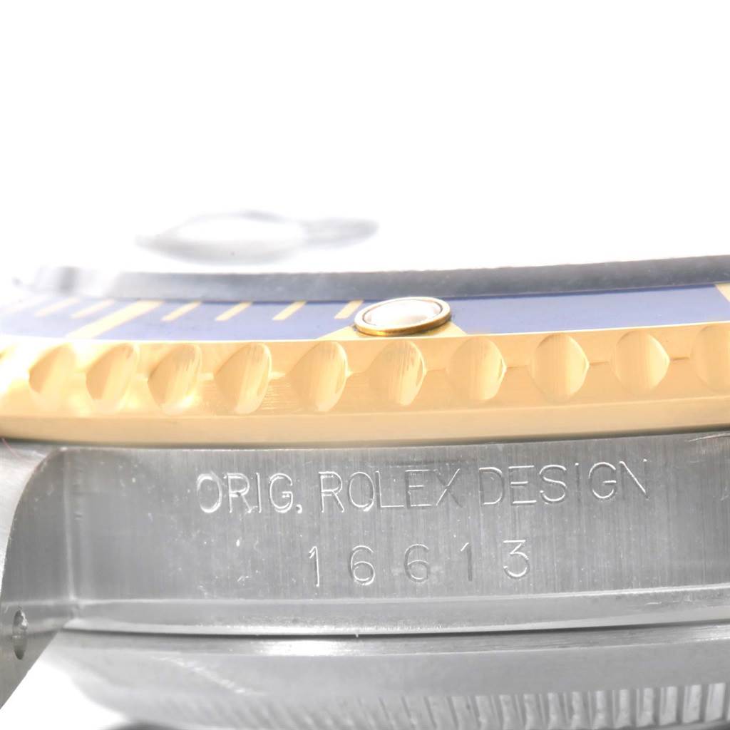 This image shows a close-up side view of the bezel and case of the Rolex Submariner 16613 Men's Steel and Gold (two tone) Blue Dial 16613 Men's Steel and Gold (two tone) Blue Dial, model 16613.