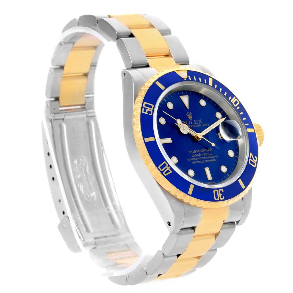 The Rolex Submariner 16613 Men's Steel and Gold (two tone) Blue Dial 16613 Men's Steel and Gold (two tone) Blue Dial watch is shown at a three-quarter angle, highlighting the blue dial, rotating bezel, and two-tone bracelet.