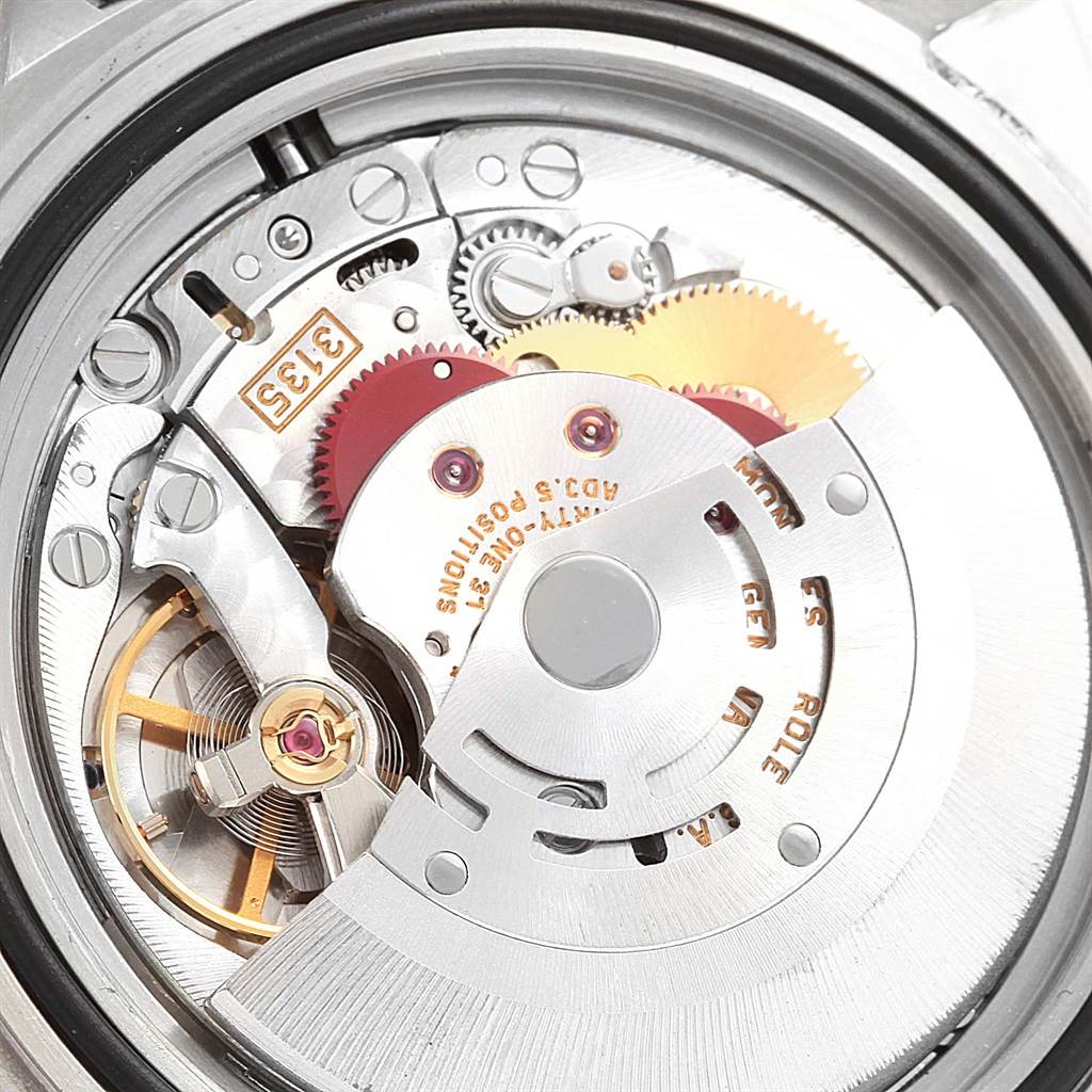 This image shows the intricate internal movement mechanism of a Rolex Submariner 16610 Men's Stainless Steel Black Dial 16610 Men's Stainless Steel Black Dial watch.