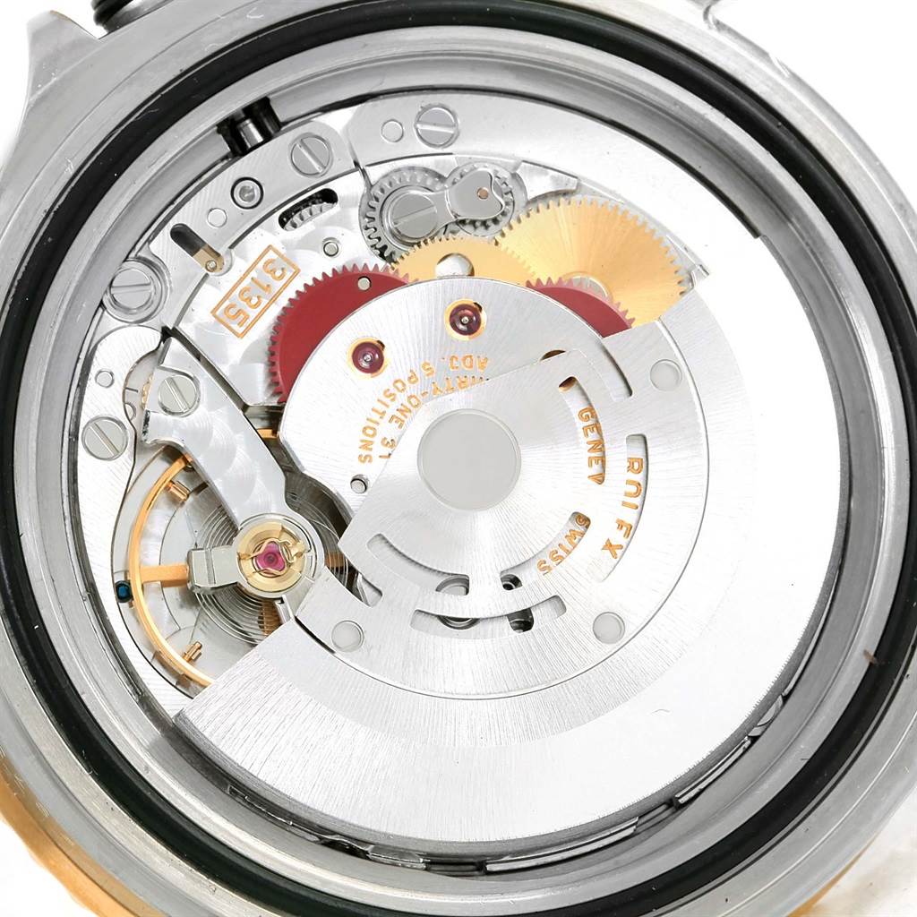 This image shows the internal mechanical movement of a Rolex Submariner 16613 Men
s Steel and Gold (two tone) Black Dial 16613 Men
s Steel and Gold (two tone) Black Dial watch from a back angle with the case removed.
