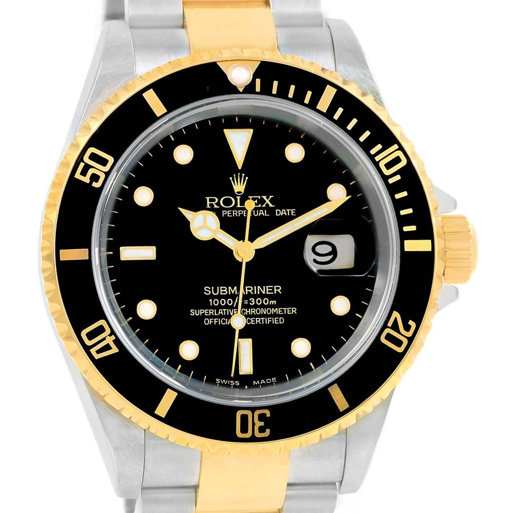 The image shows a front view of a Rolex Submariner 16613 Men
s Steel and Gold (two tone) Black Dial 16613 Men
s Steel and Gold (two tone) Black Dial watch, highlighting the face, bezel, crown, and part of the bracelet.