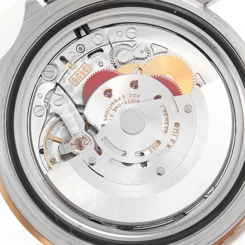 The image shows the inner mechanical movement of a Rolex Submariner 16613 Men
s Steel and Gold (two tone) Blue Dial 16613 Men
s Steel and Gold (two tone) Blue Dial watch from the backside.