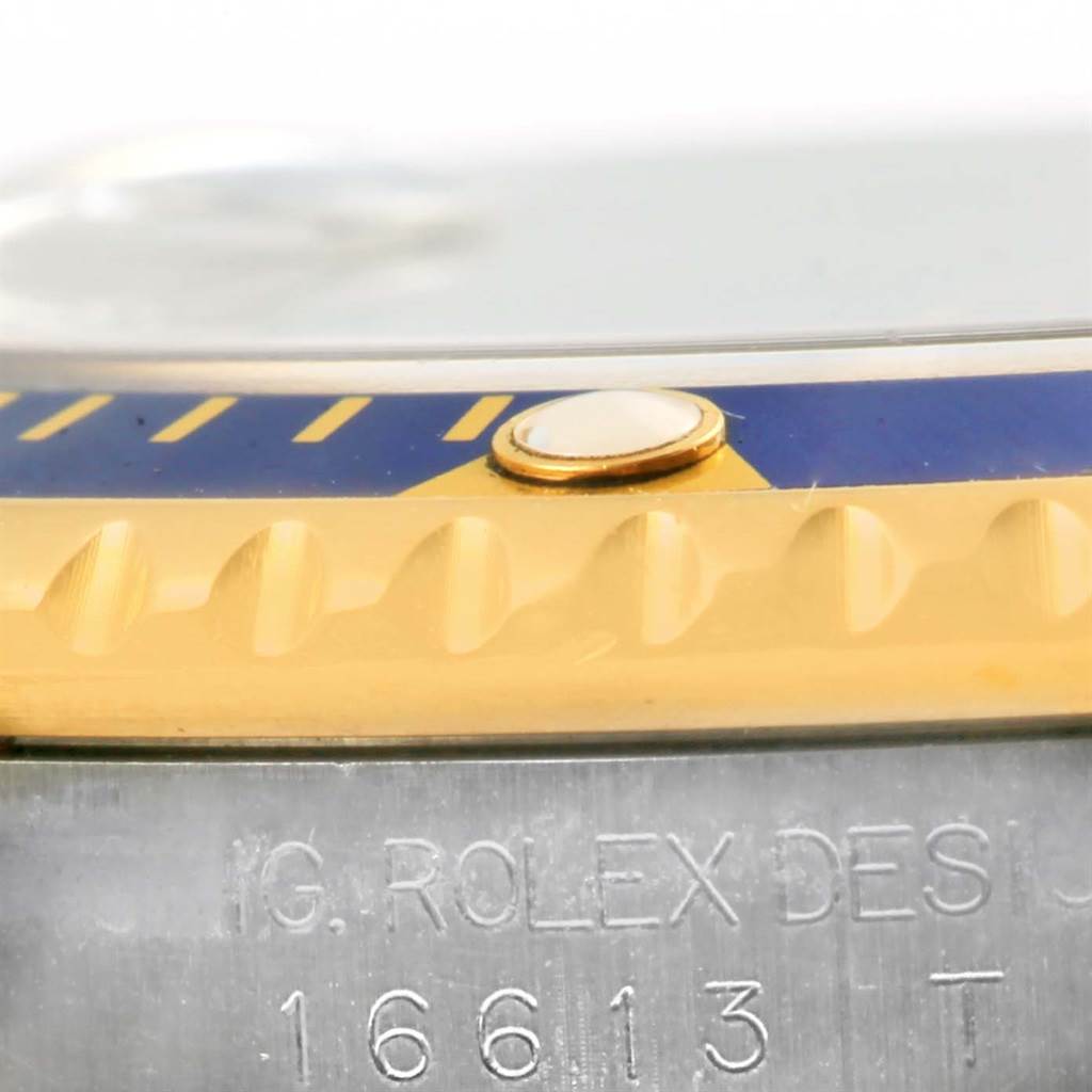 This image shows a close-up side view of the bezel and case of a Rolex Submariner 16613 Men
s Steel and Gold (two tone) Blue Dial 16613 Men
s Steel and Gold (two tone) Blue Dial.