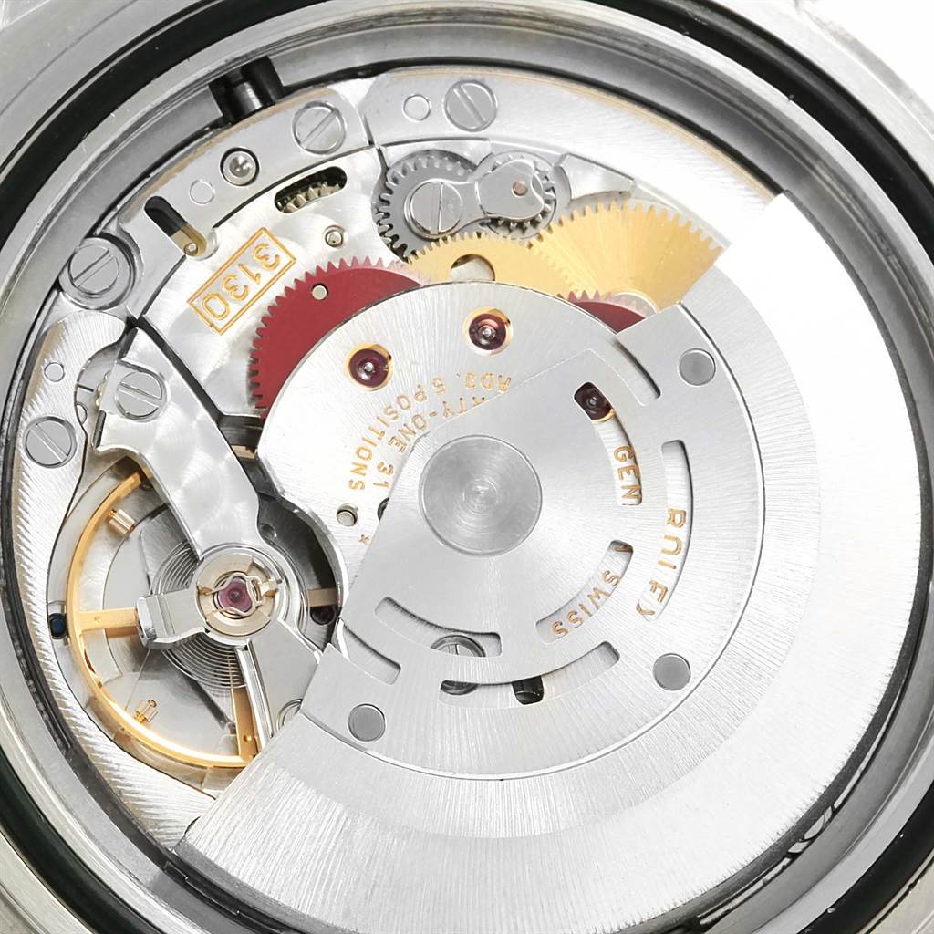 This image shows a close-up of the movement and internal mechanism of a Rolex Submariner 16613 Men
s Steel and Gold (two tone) Blue Dial 16613 Men
s Steel and Gold (two tone) Blue Dial watch.